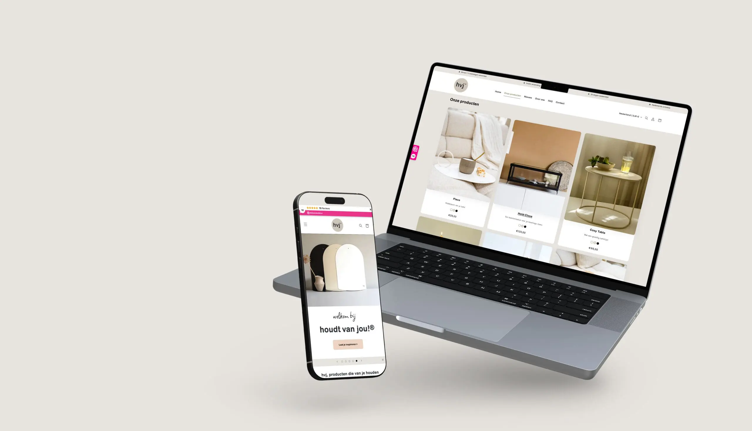 Laptop en smartphone tonen de HVJ website met interieurbeelden