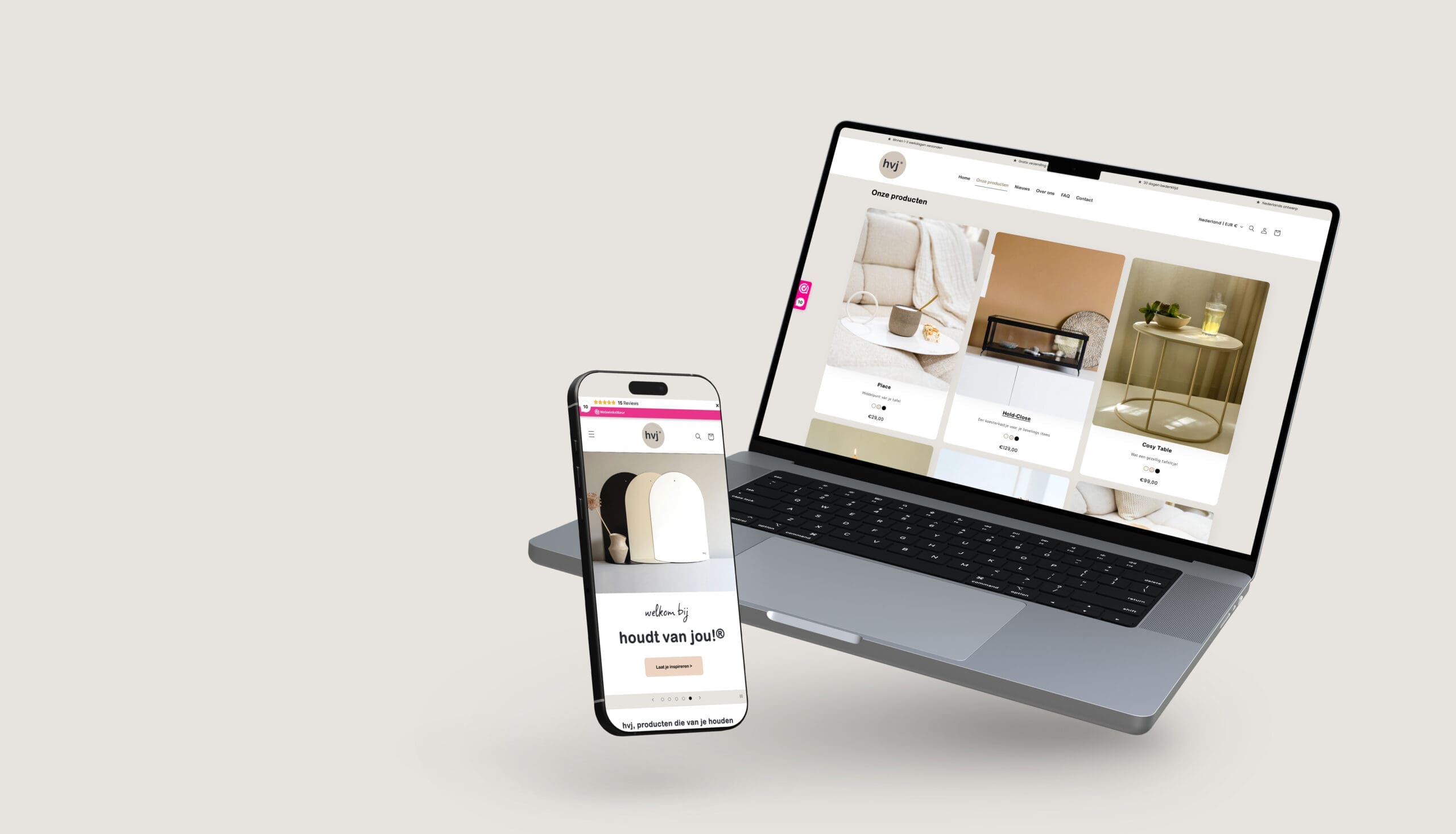 Laptop en smartphone tonen de HVJ website met interieurbeelden